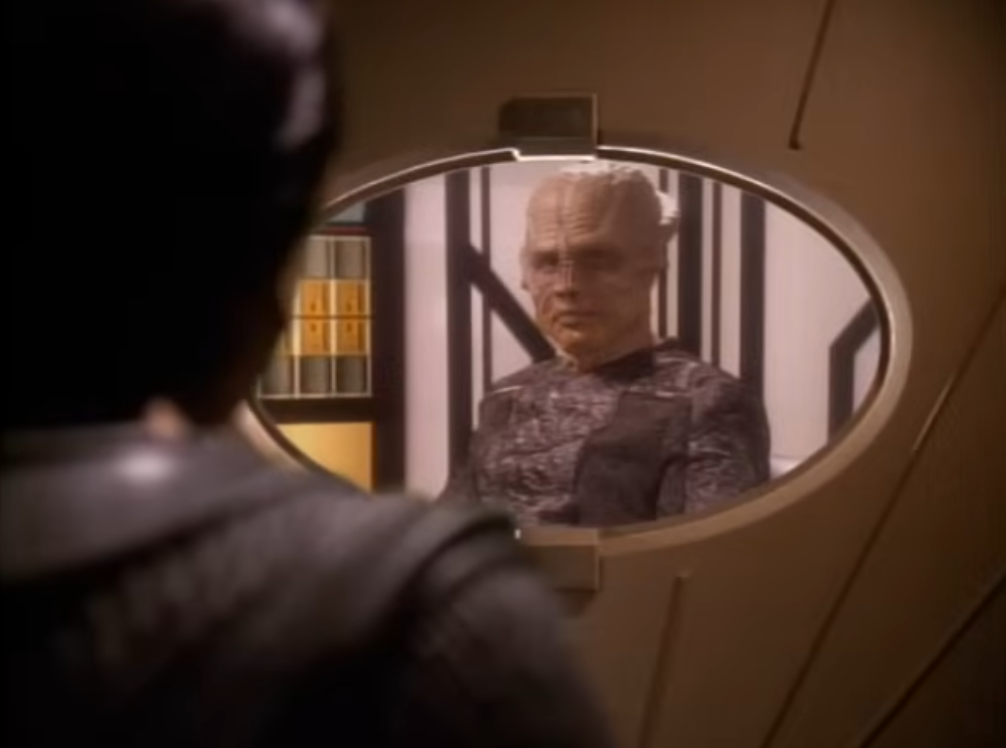 Commander Sisko disguised as Kobheerian Captain Viterian (Norman Large) by the USS Defiant's Holofilter