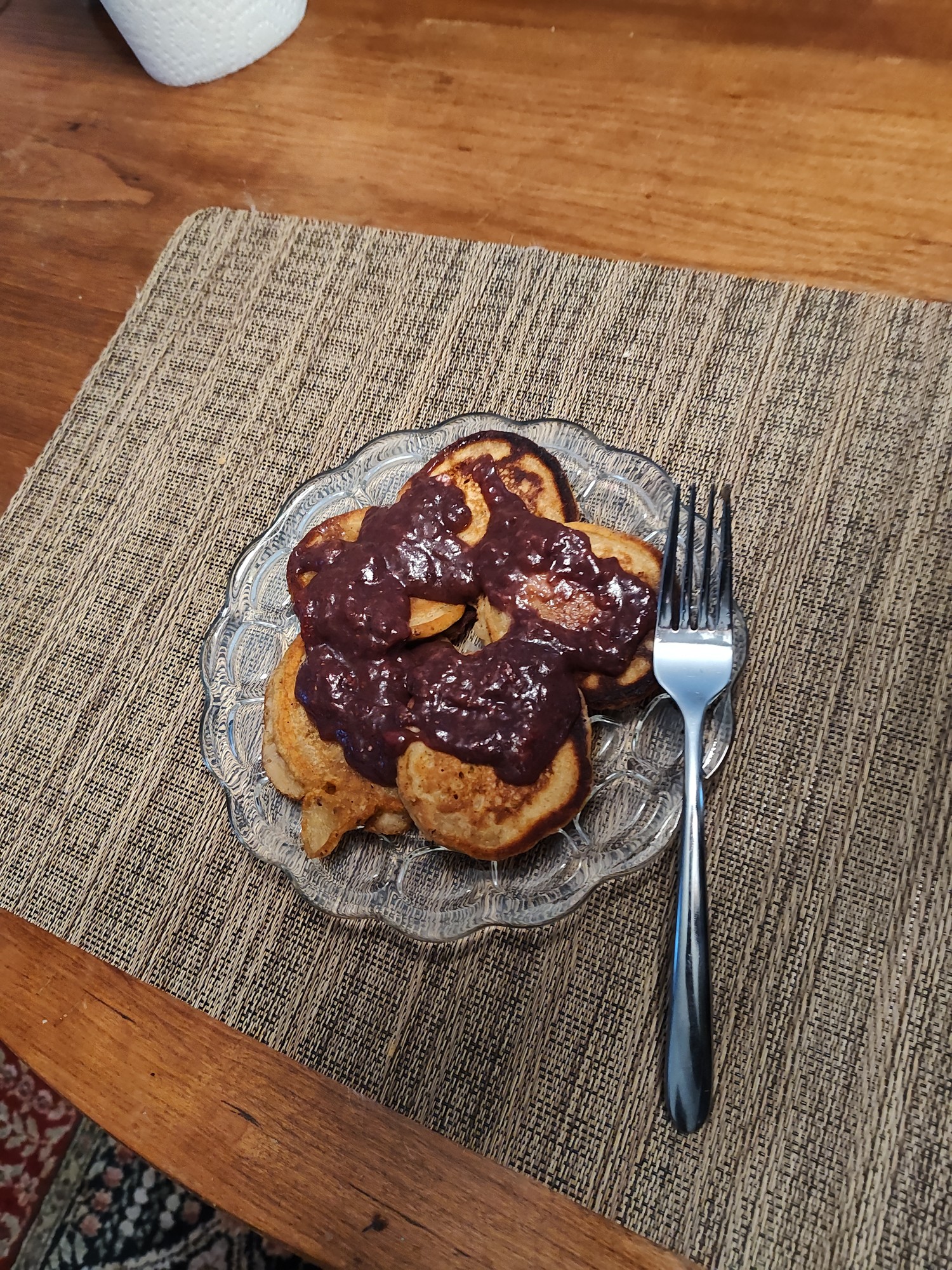 pancakes with brown-purple strawberry sauce